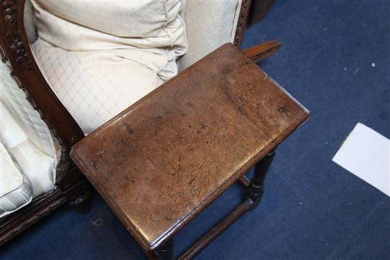 A 17th century oak joynt stool, incised with the initials W. R. 1ft. 7in. H.1ft 9in.